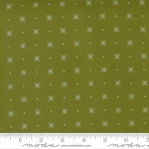 May include: Green fabric with a white crosshatch pattern. The fabric is a woven cotton blend and has a subtle texture. The pattern is repeated throughout the fabric.