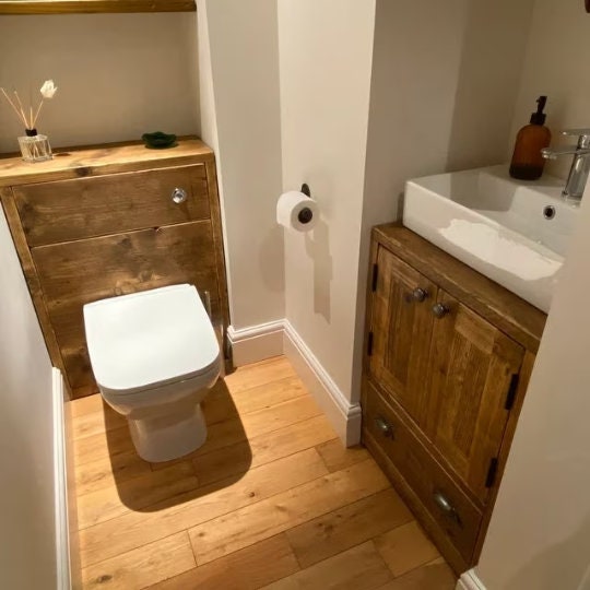Small rustic cabinet for bathroom outlet
