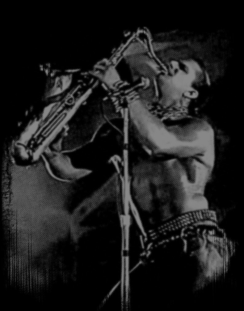 May include: A black and white photo of a person playing a saxophone. The person is wearing a shirt and pants. The saxophone is held in front of the person's face.