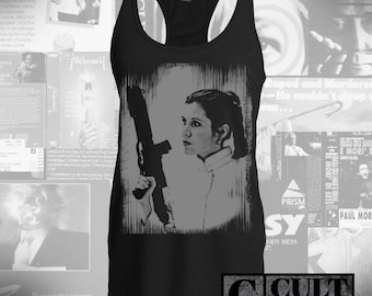 May include: Black tank top featuring a grey and white image of Princess Leia holding a blaster. The text "CULT RATED" is printed in black at the bottom of the image.
