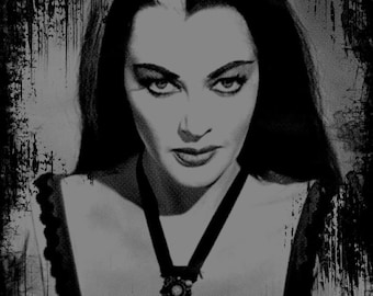 May include: Black and white portrait of a woman with dark hair parted in the middle and a white streak in her hair. She is wearing a black lace top with a black ribbon around her neck and a silver pendant.