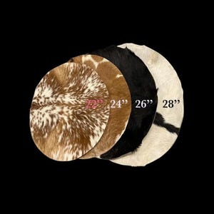 May include: Four round cowhide rugs in varying colors and patterns. Sizes are 22", 24", 26", and 28" in diameter. The rugs feature brown, black, and white tones, with visible textures and patterns.