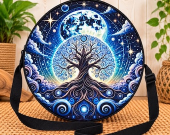 May include: A round crossbody bag featuring a vibrant graphic print of a stylized tree with swirling branches and roots set against a dark blue night sky with a large glowing moon, stars, and clouds. The bag has a black adjustable strap.