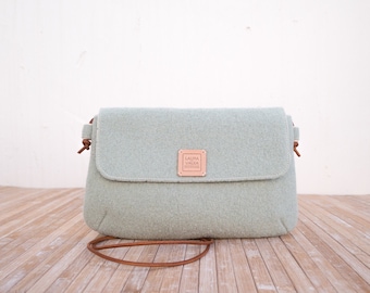 Light green wool crossbody bag for your essentials.