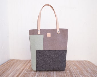 Casual tote bag with leather handles and outside pocket. Shoulder bag for any occasion.