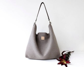 Shoulder bag hobo taupe color. Light brown wool bag with leather strap.