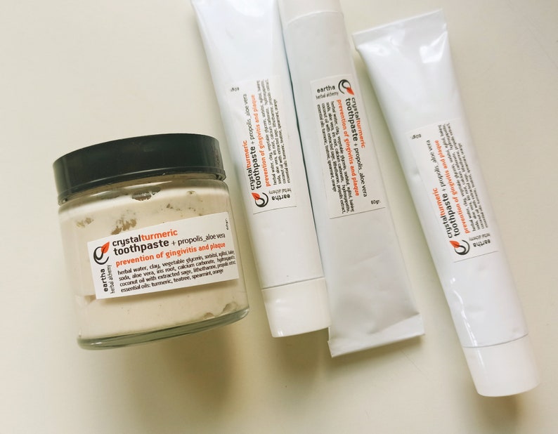May include: Four tubes of natural toothpaste with the brand name "eartha" and the product name "crystalturmeric toothpaste". The toothpaste is described as "propolis, aloe vera, prevention of gingivitis and plaque".