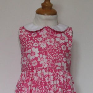 Girl&#39;s dress size 2 years in cotton with pink background and white flowers