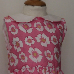 Girls&#39; cotton dress, size 4, pink background, white flowers