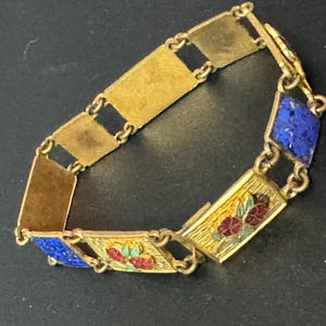 Antique brass enamelled panel link bracelet with blue gold and flower details