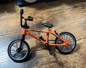 Miniature plastic orange mountain bike BMX cake topper decoration