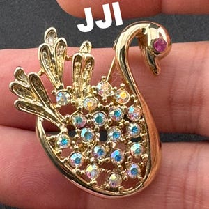 Signed JJI minimalist stylised Aurora borealis AB diamanté swan brooch gold tone