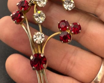 ruby red glass rhinestone floral brooch , mid century gold tone