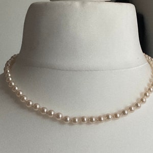 vintage single strand cream glass pearl necklace with ornate sterling silver gilt clasp