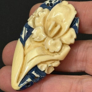 Early Plastic cream and blue carved Celluloid ladies single dress clip