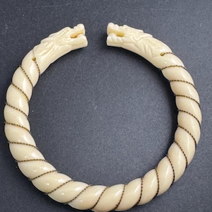 Early Plastic double dragon head bangle, wire wrapped celluloid twisted detail