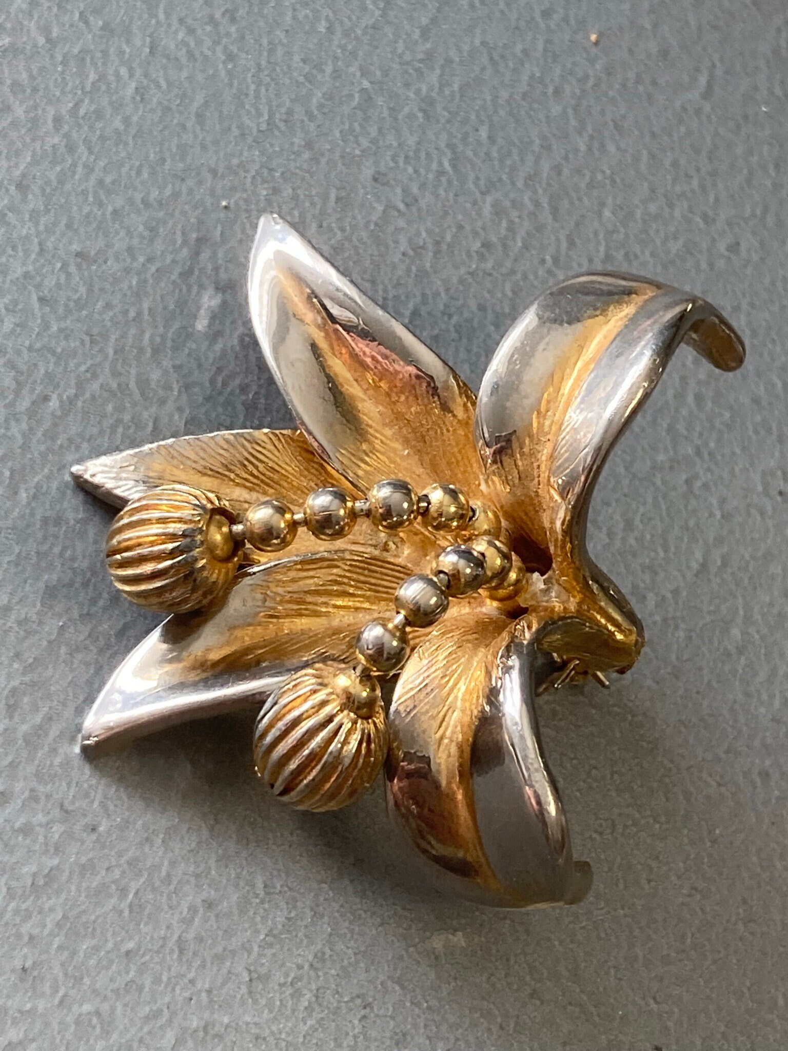 Hollywood stamped brooch deals