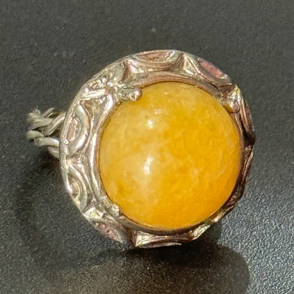 Celtic modernist Silver tone steel adjustable ring with central orange yellow glass cabochon 1970s vintage