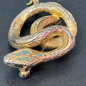 Signed sphinx Vintage gold tone snake brooch with turquoise blue eyes vintage