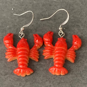 Orange plastic nautical lobster dangly earrings pierced ears