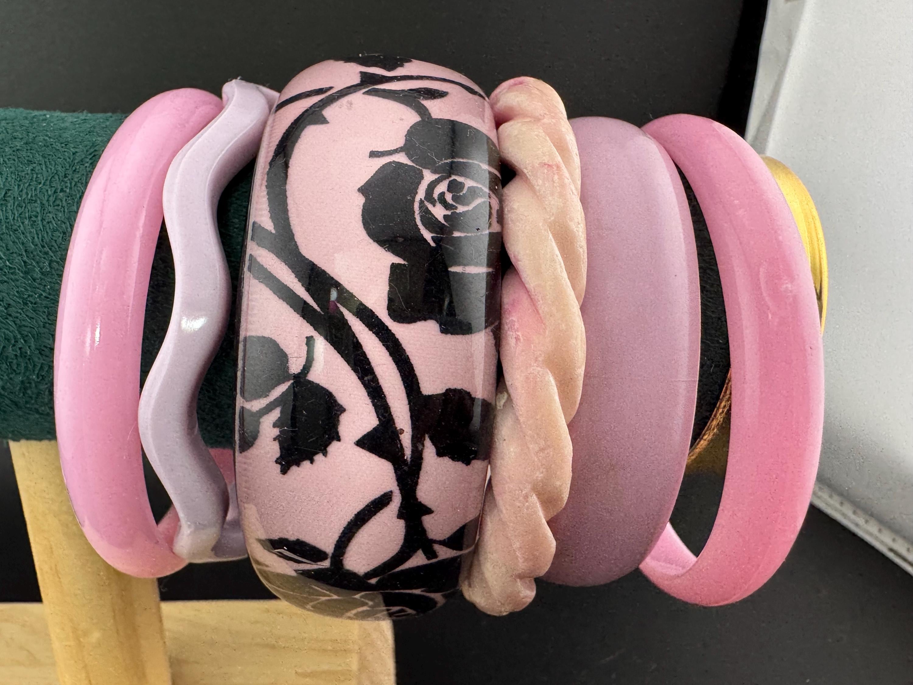 Vintage curated stack of pink plastic bangles retro acrylic bracelets