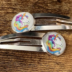 pair of Unicorn hair clips silver tone snap lock closure