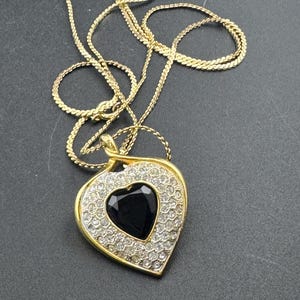 Signed Sphinx black glass crystal love heart diamanté pendant necklace on a long gold plated serpentine chain