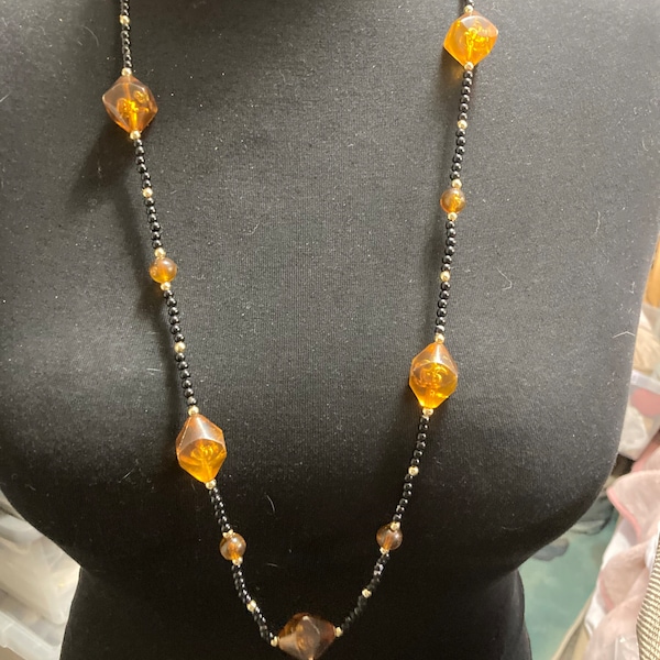 Long faux amber plastic beaded necklace with black gold seed beads 95cm