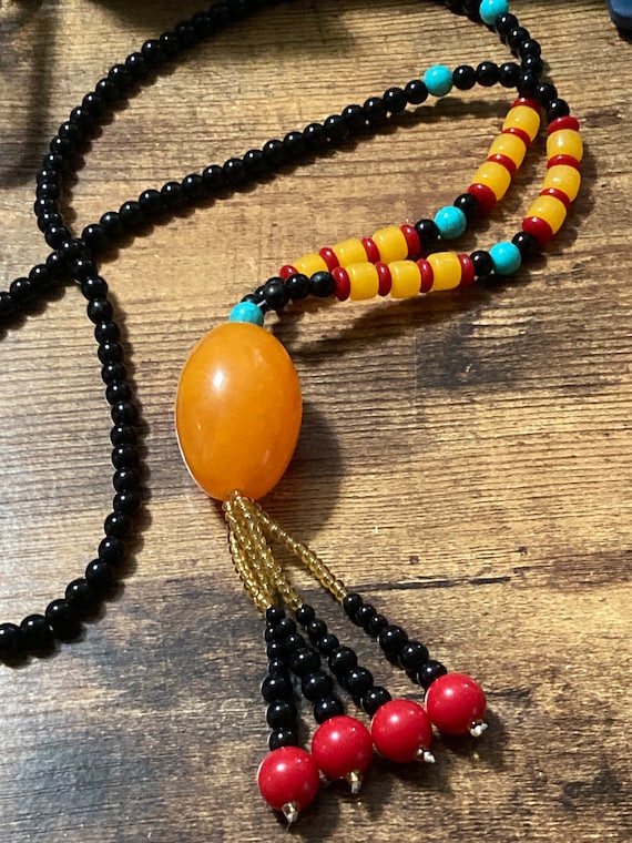 Oversized glass and plastic beaded wrap necklace Orange yellow red black turquoise tones