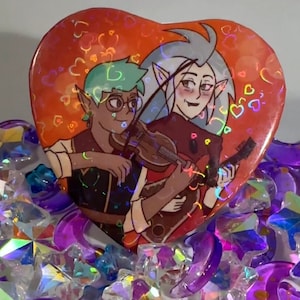 Eda and Raine Heart Holographic Button | The Owl House
