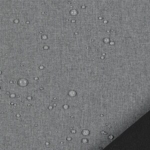 May include: A grey fabric with a visible woven texture featuring numerous clear water droplets scattered across the surface. A solid black corner section is visible in the bottom right, contrasting with the textured grey material.