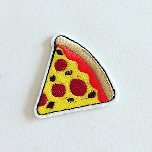 May include: An embroidered iron-on patch of a pizza slice with pepperoni, in yellow and red.