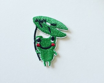 Frosch Bügelbild: Grünes gesticktes Bild mit Blatt