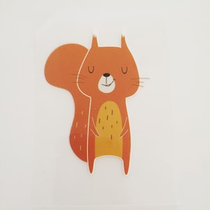 May include: A cartoon illustration of a smiling orange squirrel with closed eyes. The squirrel has a bushy tail and a yellow belly.