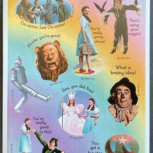 May include: A set of colorful stickers featuring characters from the Wizard of Oz. The stickers include Dorothy, the Scarecrow, the Tin Man, the Cowardly Lion, and Glinda the Good Witch. The stickers have text on them, such as "Oz-some, just Oz-some!" and "You're really going places!"