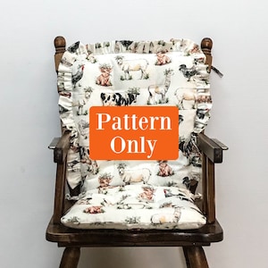May include: A chair cushion with a farm animal pattern, including cows, sheep, and chickens, is displayed on a wooden chair. The cushion has a ruffled edge and the text "Pattern Only" is visible.