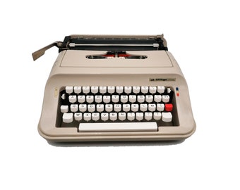 Machine à écrire vintage beige révisée ruban neuf Scheidegger Président
