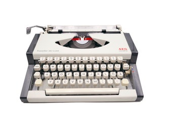 Vintage typewriter revised ribbon nine Olympia Traveller Luxury white