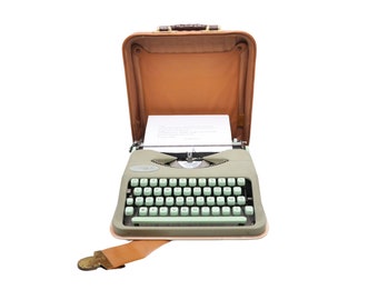 Revised vintage typewriter new ribbon Hermes Baby Rocket linden green in brown suitcase