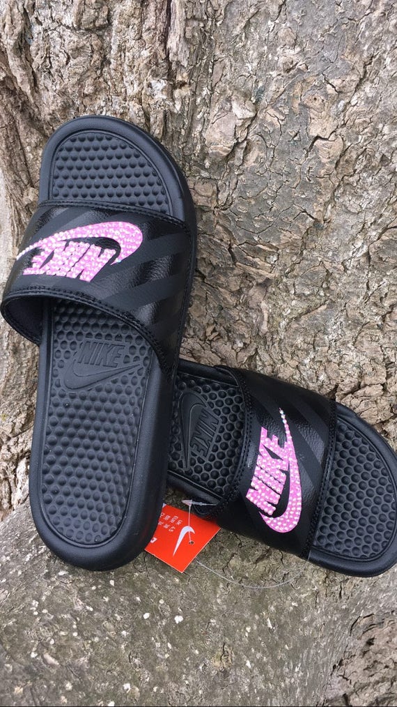 black and pink nike slides