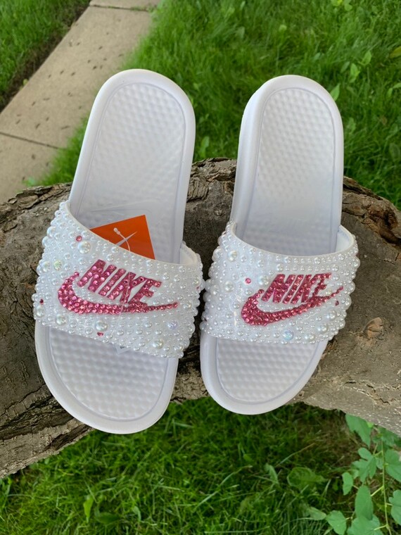 pink and white nike slides