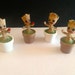 Baby plant with flowerpot and flower in hand for miniature fairy garden, fairy garden Groot baby You can choose different models
