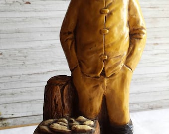 Vintage Orzeck-Figurine. Manufactured Ware, MA. New England Fisherman with his boots + yellow rain gear Very-Nice-Cond. 9" tall and 4" wide