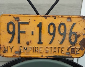 Vintage 1962 New York State License Plate. Black numbers with yellow background. Nicely used Condition. Plate No. 9F-1996.Nice Collectible