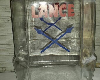 Vintage 1950s Lance Crackers Country Store Jar. No Lid. Excellent graphics. No paint fade. Double Crossed Arrows on 2 Sides. Stands 10 1/2".