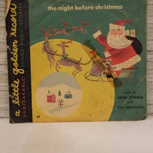 May include: A vintage 7-inch record with a yellow and green label. The record features a colorful illustration of Santa Claus in a red suit riding in a sleigh pulled by reindeer. The text on the label reads "a little golden record" and "the night before christmas".