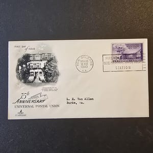May include: A white envelope with a black and white image of a building and text. The envelope is stamped with "First Day of Issue" and "75th Anniversary Universal Postal Union". Additional stamps and text are also present.