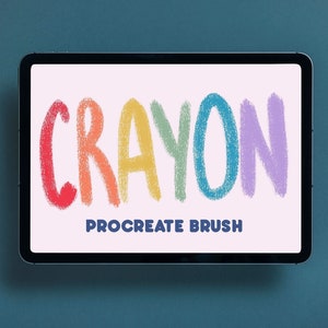 以下が含まれることがあります： ピンクの背景に虹色の「CRAYON」という言葉のデジタルイラスト。テキストはクレヨンで描いたようにスタイリッシュにデザインされています。「PROCREATE BRUSH」というテキストは「CRAYON」という単語の下にあります。