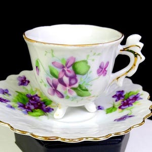 Japanese Porcelain Purple Violets 3 Toed 2 1/4" Demitasse Cup & Saucer Set 1960s