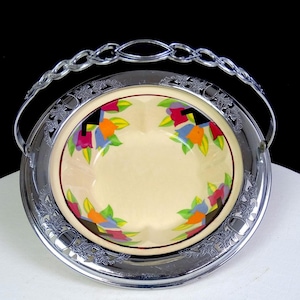 May include: A handmade, wooden serving tray with a natural finish. The tray features a rectangular shape with raised edges and two handles. The wood grain is visible, showcasing the tray's rustic charm.